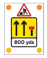 Signs used on the back of slow-moving or stationary vehicles warning of a lane closed ahead by a works vehicle. There are no cones on the road.